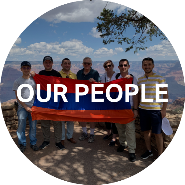 Photo of team with a view of a mountain, in front is text that reads Our People